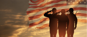 Soldiers salute in front of the American flag as the sun sets, a powerful reminder of the bravery and sacrifice honored on Veterans Day. Photo from The Moors Master Maintenance Association, accessed in Nov. 6

